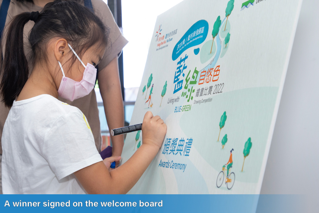 A winner signed on the welcome board