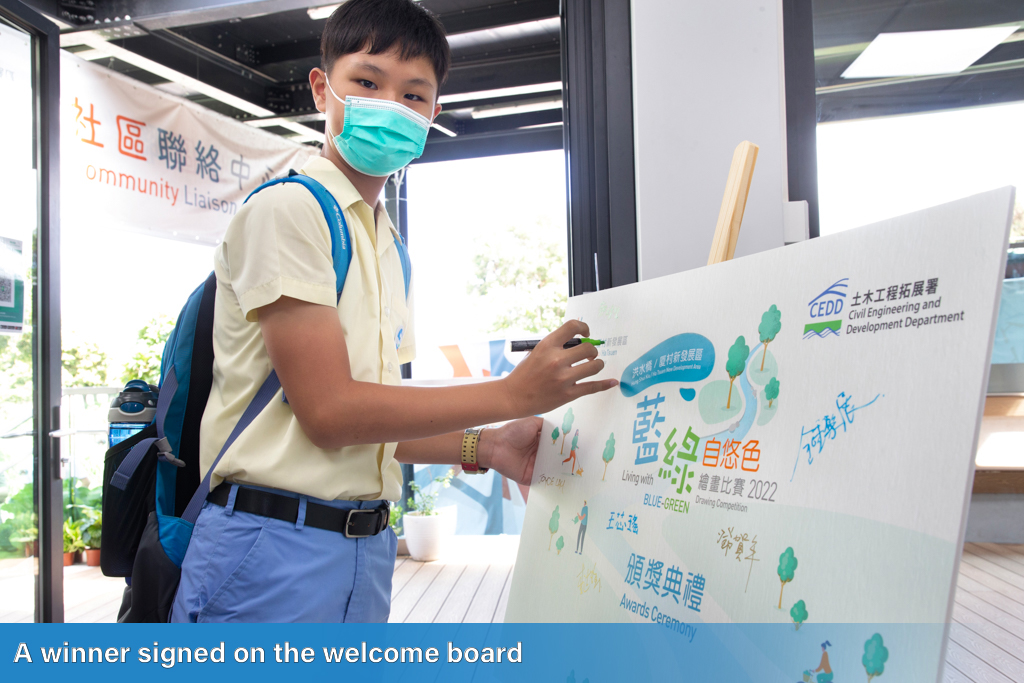 A winner signed on the welcome board